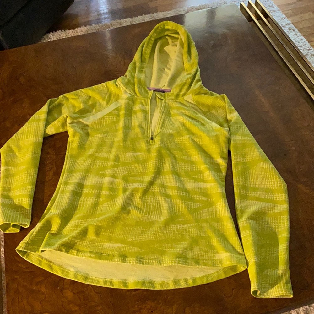 Polyester/spandex, chartreuse in color. Medium